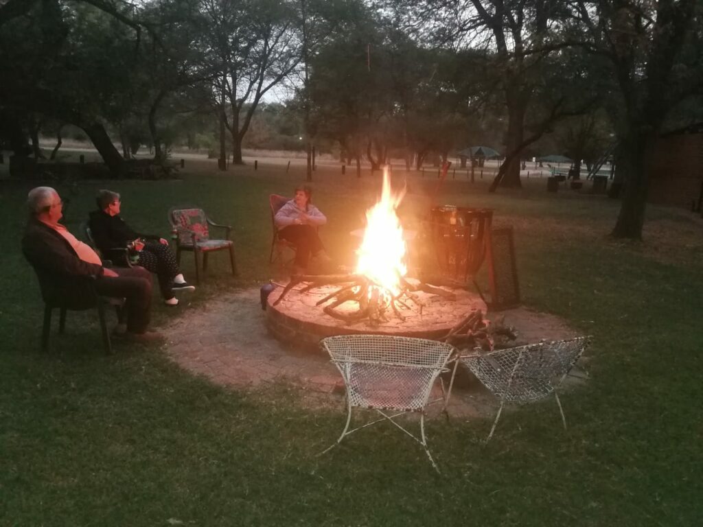 Friends gathered around the campfire